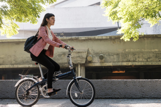 Executive on a bicycle for a visit